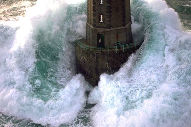 Lighthouse engulfed by stormy seas