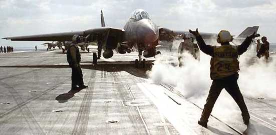 F16 aircraft landing on aircraft carrier