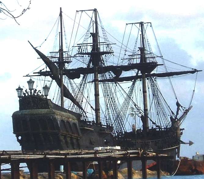 Ghost ship with rigging docked