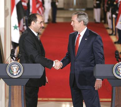 President Bush shakes hands with Iraqi Prime Minister Nouri al-Maliki