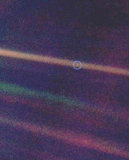 The Pale Blue Dot, a Voyager 1 photo showing Earth (circled) as a single pixel from 4 billion miles away