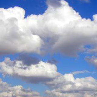 Cotton wool clouds and blue sky