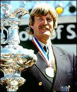 Sir Peter Blake holds the America's Cup in 1995