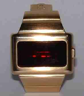 Omega digital time computer, gold and synthetic ruby face