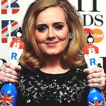 Adele with her prizes at the Brit Awards