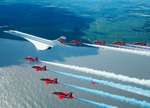 British Airways Concorde flies with the Red Arrows on its final flight into London Heathrow.