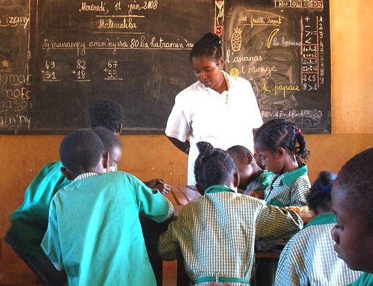 Education is key to understanding for world peace, Madagascar schoolchildren and teacher