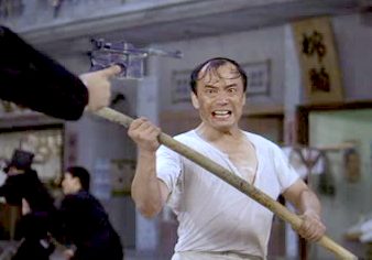 Donut with his bamboo stick starts fighting the Axe Gang when they resort to firearms Kung fu Hustle