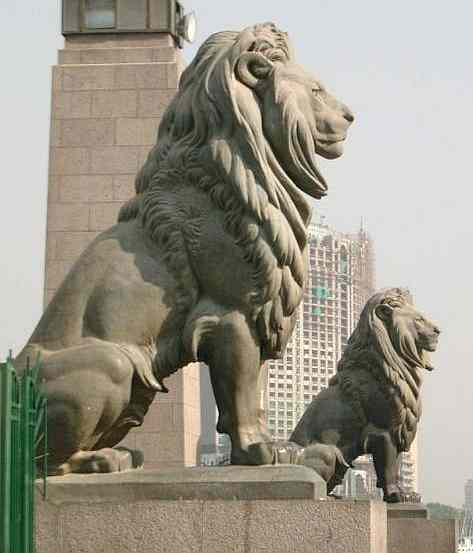 Lions guard the Kasr-el-Nil Bridge which traverses the Nile at Tahrir Square, Egypt