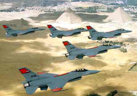Egyptian F-16s flying in close formation over Pyramids