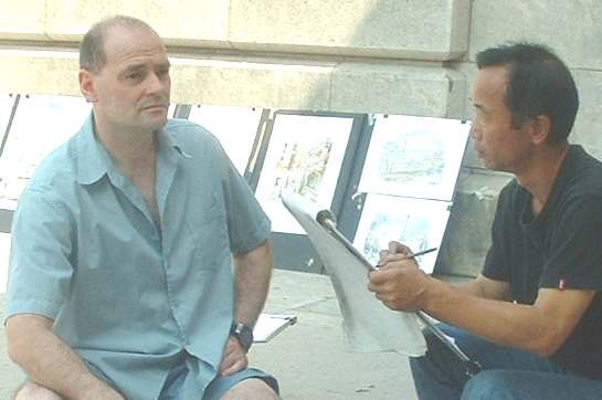 Entrepreneur Nelson Kay poses for a local street artist during the heat wave of 2003, along the banks of the River Seine, Paris, France