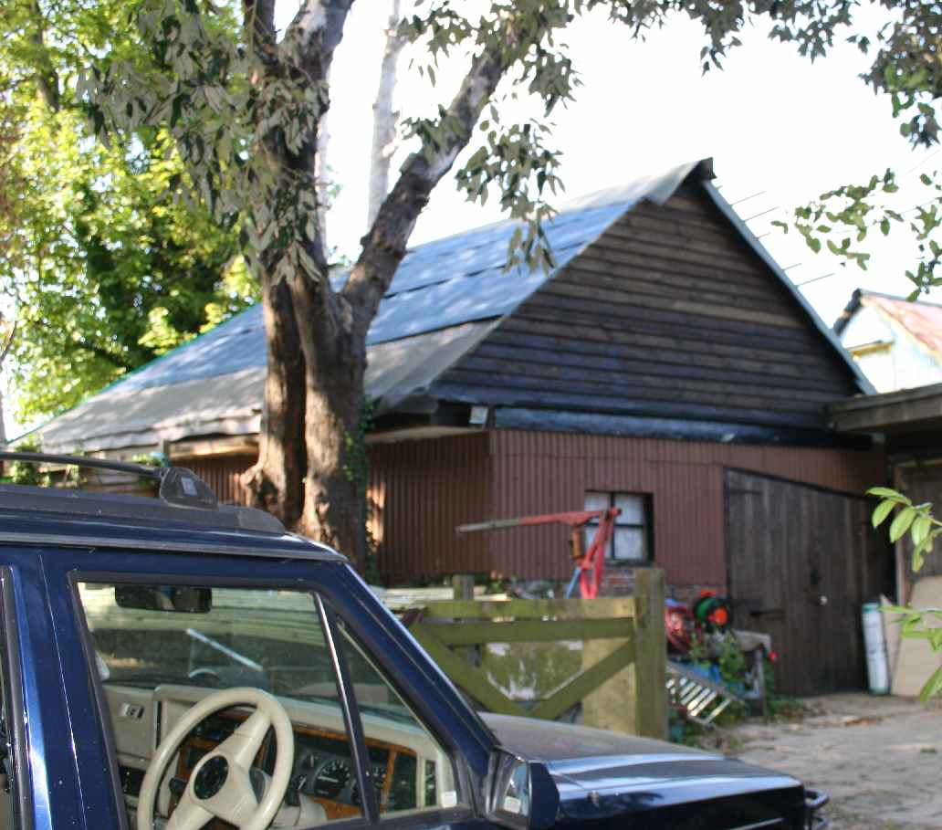 Jeep parked under oak tree in May 2007 Herstmonceux Sussex