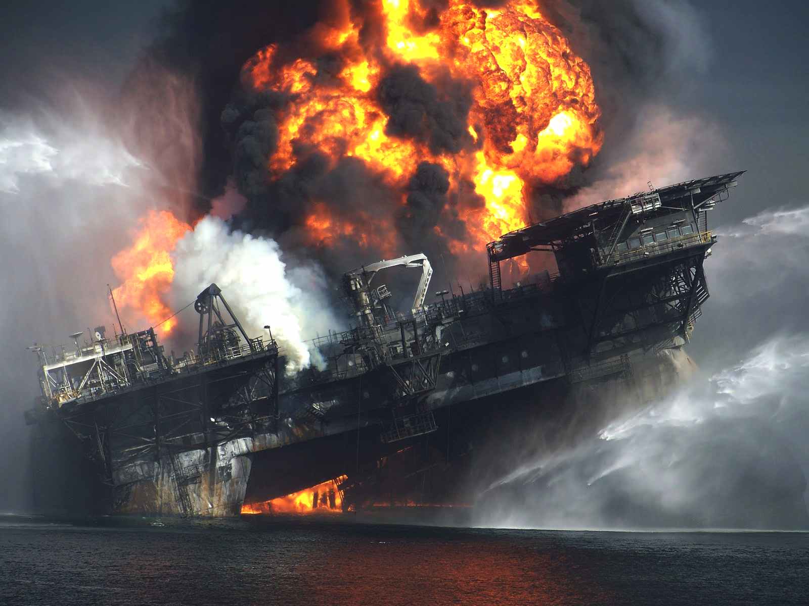 BP Deepwater Horizon oil rig collapsing ablaze